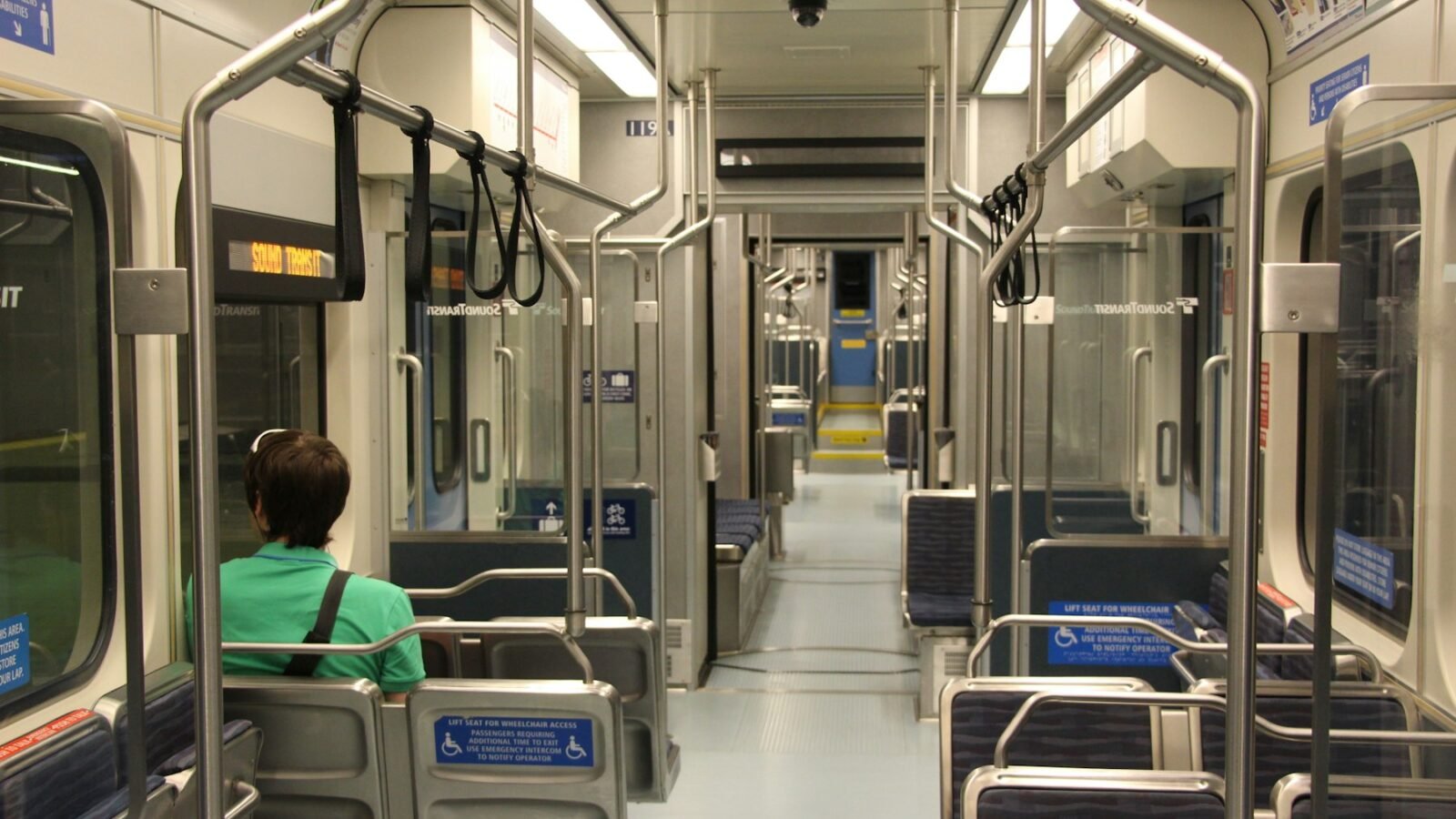 Passenger looking out the window of a Seattle Link light rail train