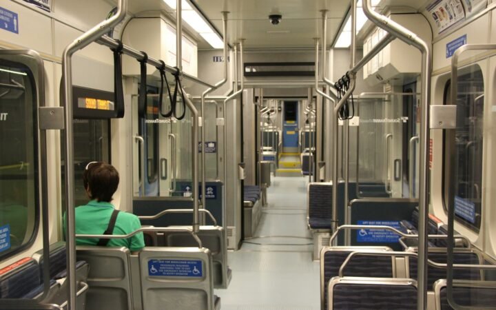 Passenger looking out the window of a Seattle Link light rail train